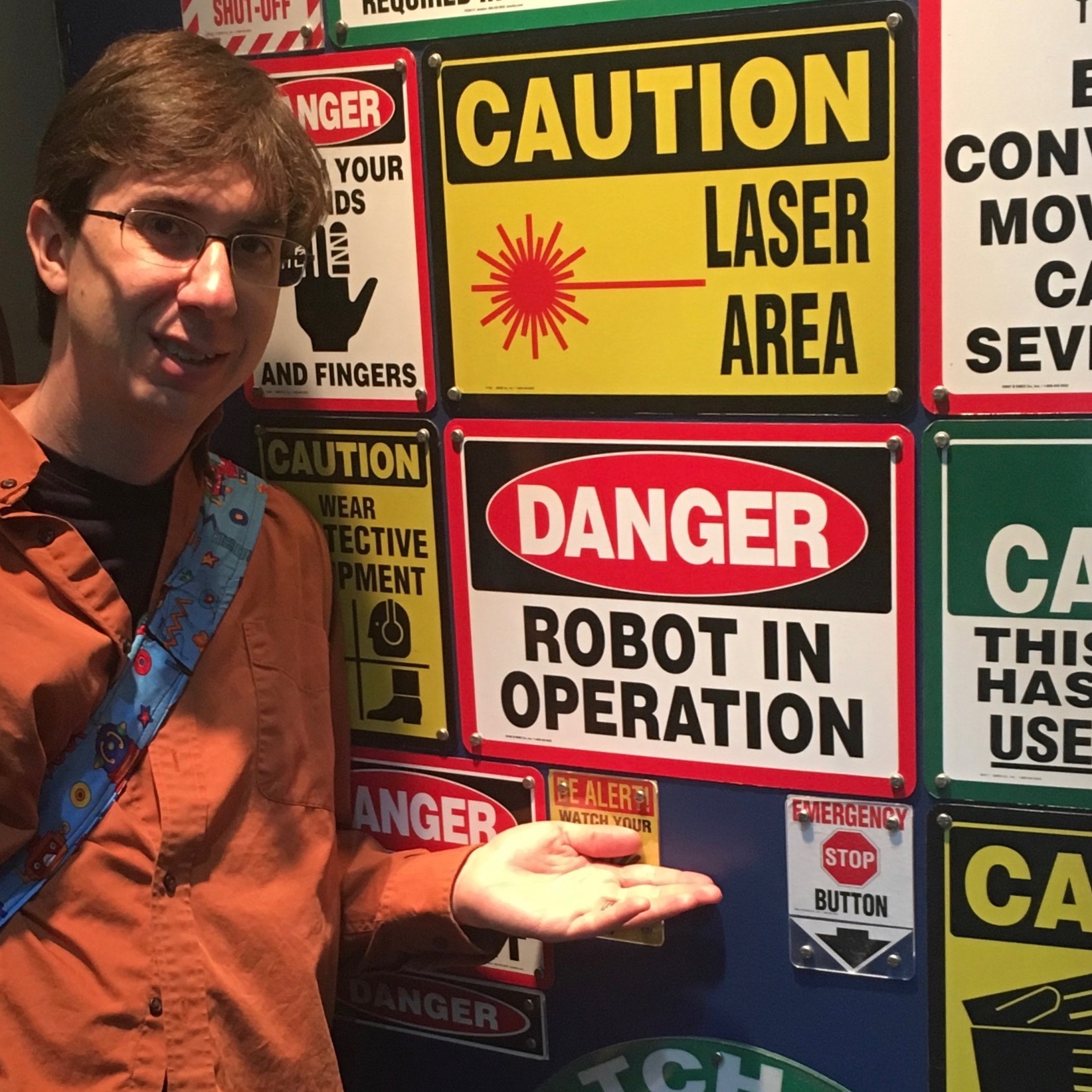 daniel with robot and laser signs